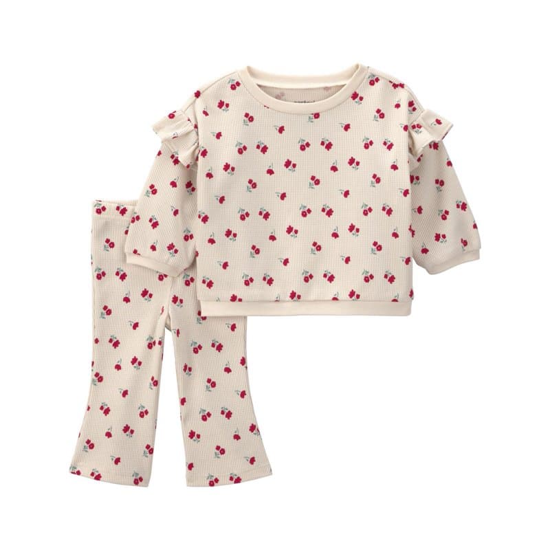 Cream top and flared pants with a small red floral print