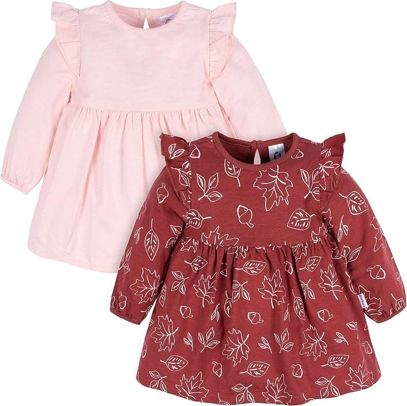 Two ruffle-shoulder dresses in pale pink and burgundy with a leaf print