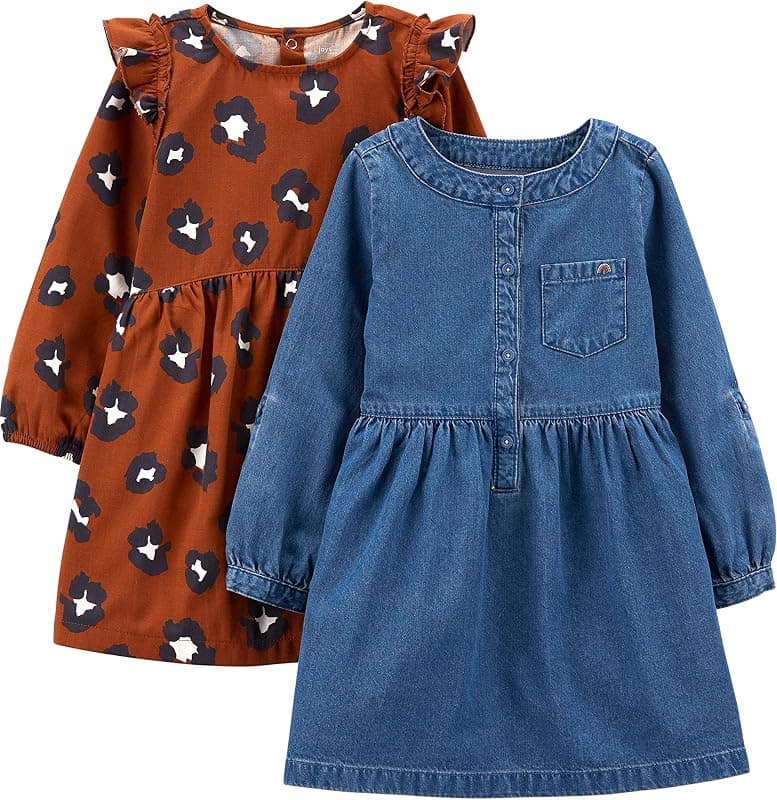 Two long-sleeve baby dresses: rust with a cream pattern, and soft denim